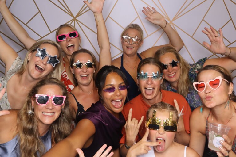 photobooth guests posing with props